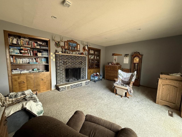 carpeted living room featuring a fireplace and a textured ceiling