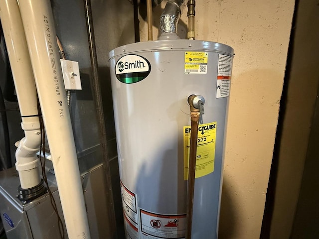 utility room featuring gas water heater