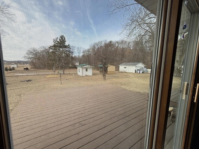 wooden deck with a shed