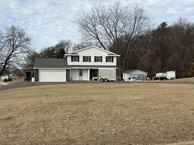 front of property featuring a garage and a front yard