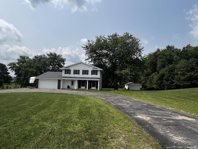 view of front of property with a garage and a front yard