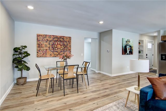 dining space featuring light hardwood / wood-style flooring