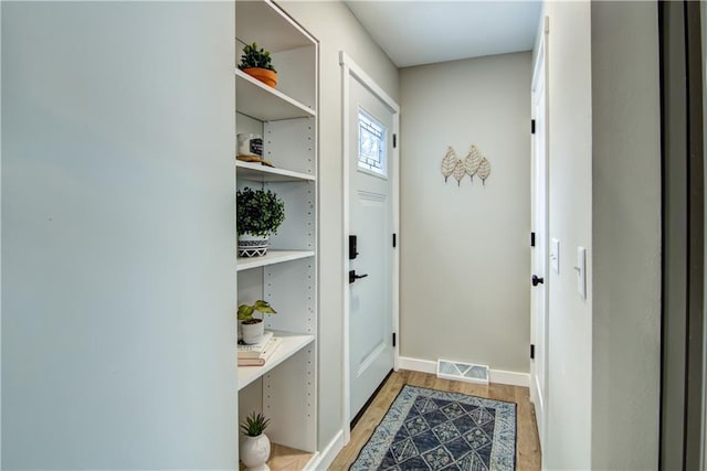 doorway with light hardwood / wood-style flooring