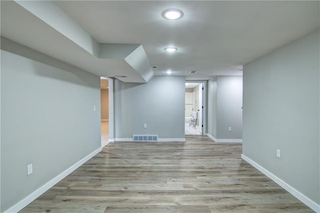 basement featuring light wood-type flooring