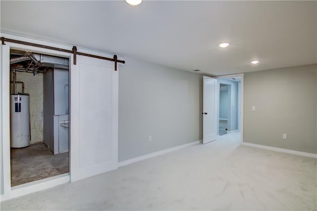 basement featuring water heater and a barn door