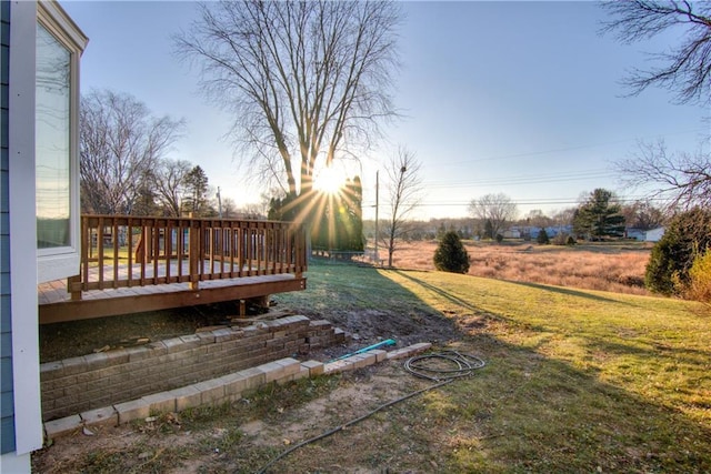 yard at dusk with a deck