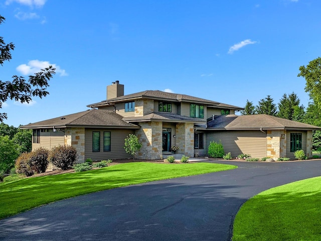 prairie-style house featuring a front yard