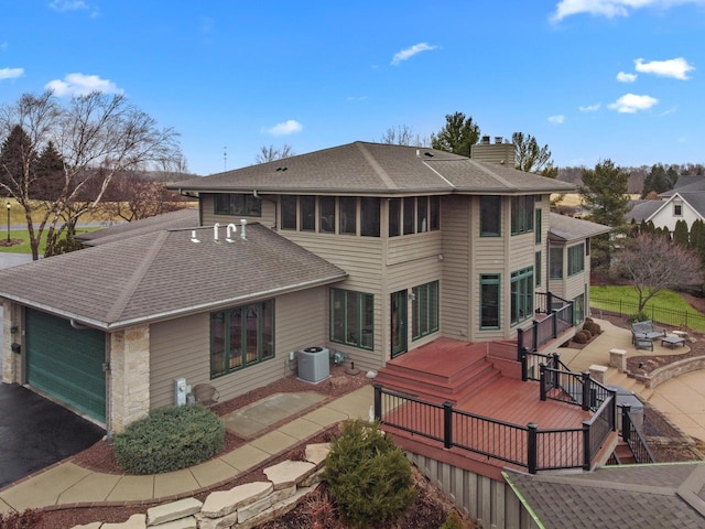 back of house featuring a patio area, central air condition unit, and a deck