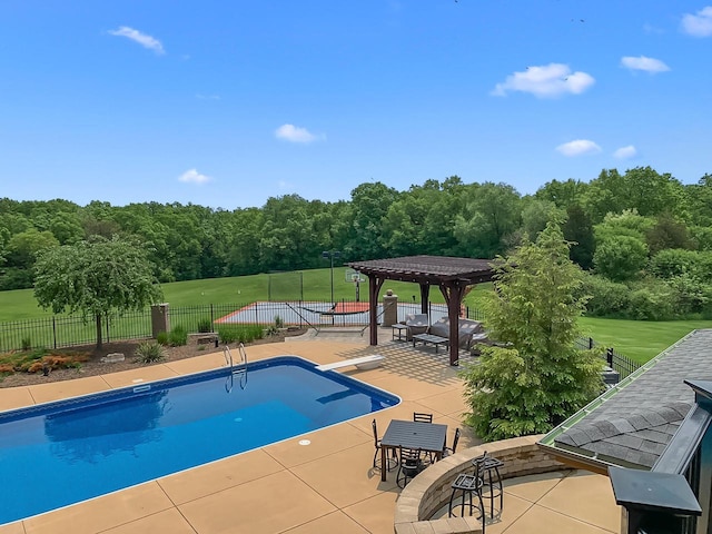 view of swimming pool with a diving board, a patio area, and a pergola