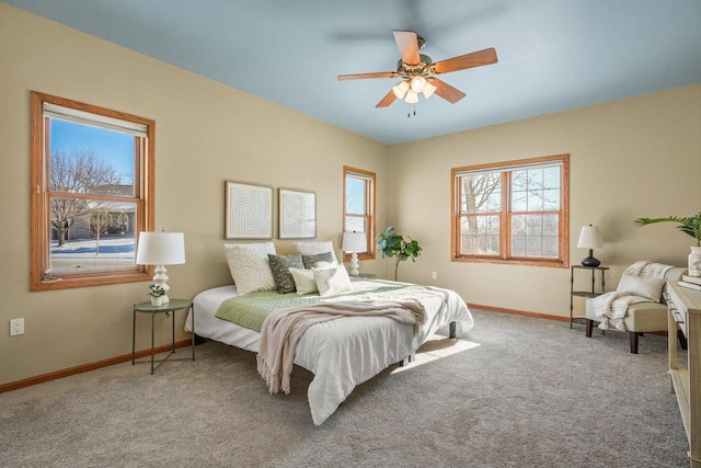 bedroom with ceiling fan and carpet