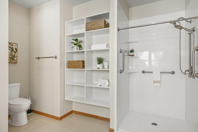 bathroom with toilet, tile patterned floors, and walk in shower