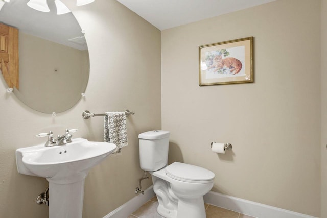 bathroom featuring tile patterned floors and toilet