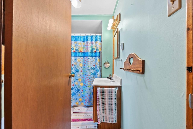 bathroom with vanity and curtained shower