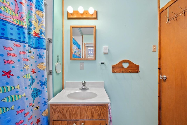 bathroom with vanity and curtained shower