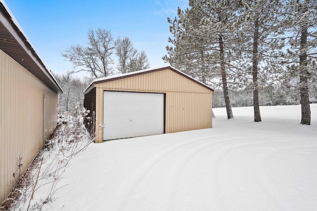 view of snow covered garage