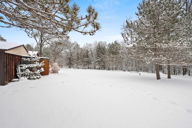 view of yard layered in snow