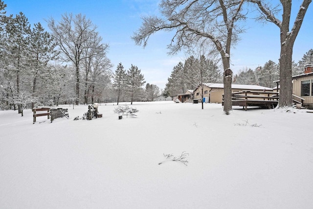 view of yard layered in snow