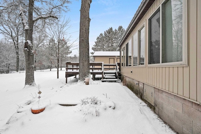 view of yard layered in snow