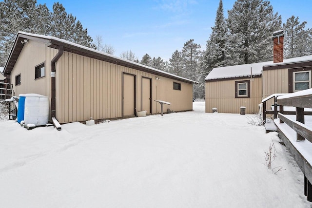 view of snow covered house