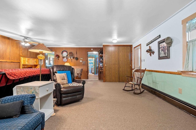 bedroom featuring wooden walls, carpet floors, and multiple windows