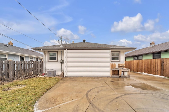 back of property featuring cooling unit and a patio area