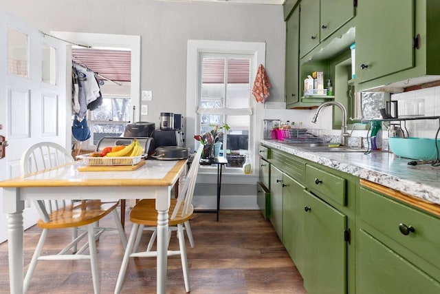 kitchen with sink, dark hardwood / wood-style floors, and green cabinets