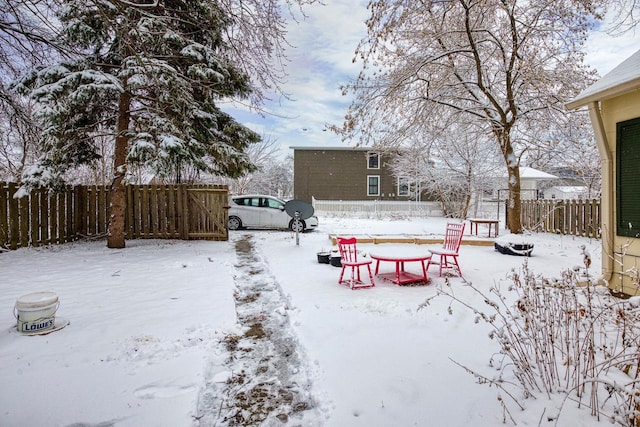 view of yard layered in snow