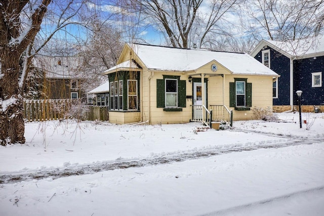 view of front of property featuring a sunroom