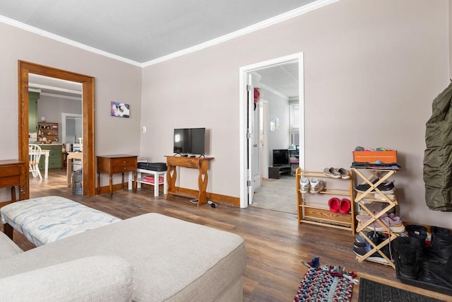 living room featuring dark hardwood / wood-style flooring and ornamental molding