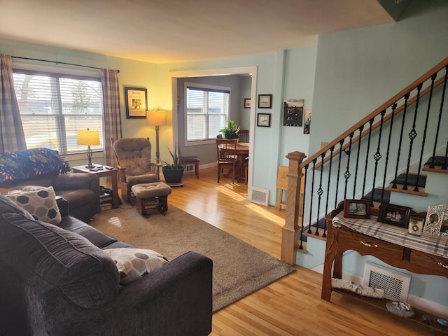 living room with light hardwood / wood-style flooring