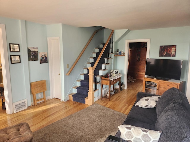 living room with light hardwood / wood-style flooring