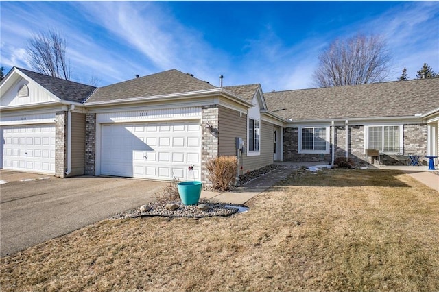 single story home with a garage and a front yard