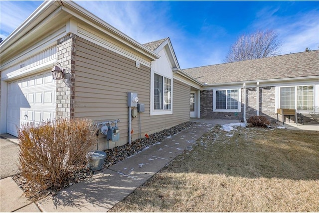 view of property exterior featuring a garage