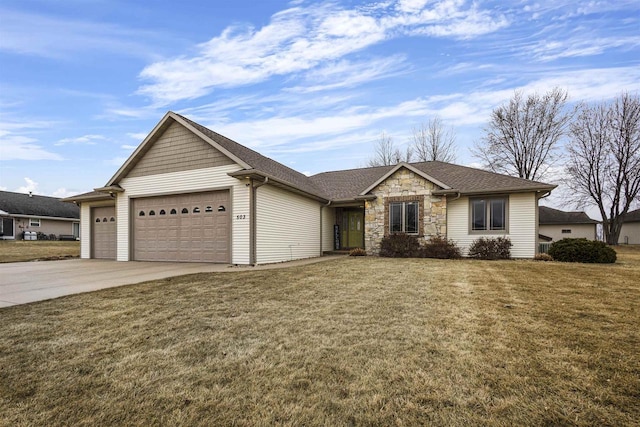 ranch-style home featuring a garage and a front lawn