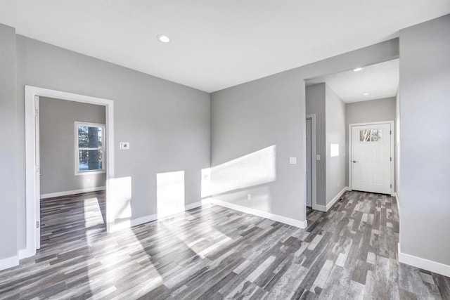 unfurnished room with hardwood / wood-style floors