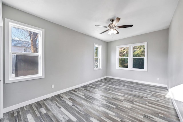 unfurnished room with ceiling fan and hardwood / wood-style floors