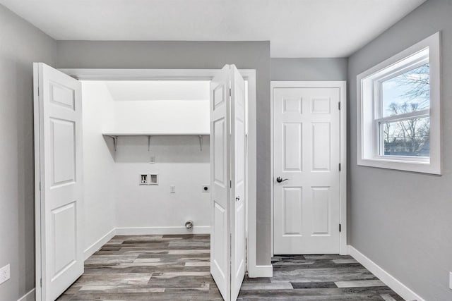 laundry room featuring dark wood-type flooring and washer hookup