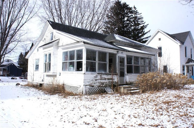 view of front of house with a sunroom