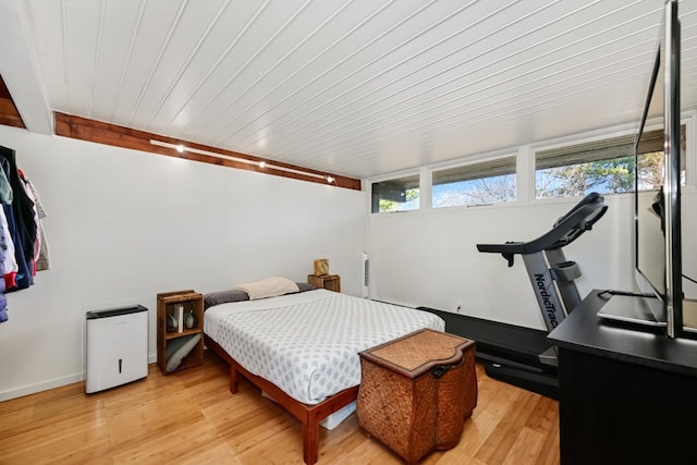 bedroom featuring wood ceiling and light hardwood / wood-style flooring