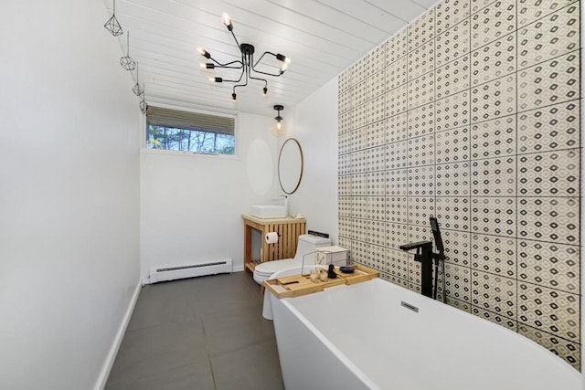 bathroom featuring a washtub, wood ceiling, baseboard heating, vanity, and tile patterned floors