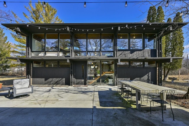 rear view of house featuring a patio