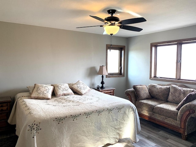 bedroom featuring ceiling fan and hardwood / wood-style floors