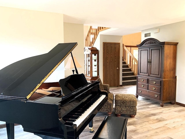 miscellaneous room with light hardwood / wood-style floors
