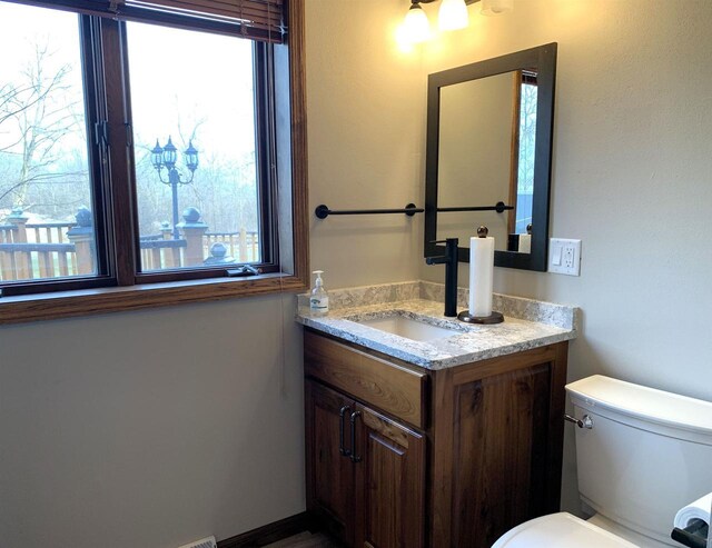 bathroom with vanity and toilet