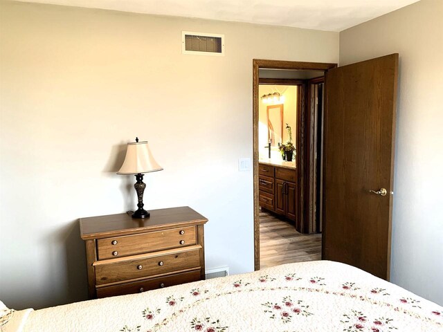 bedroom featuring light wood-type flooring