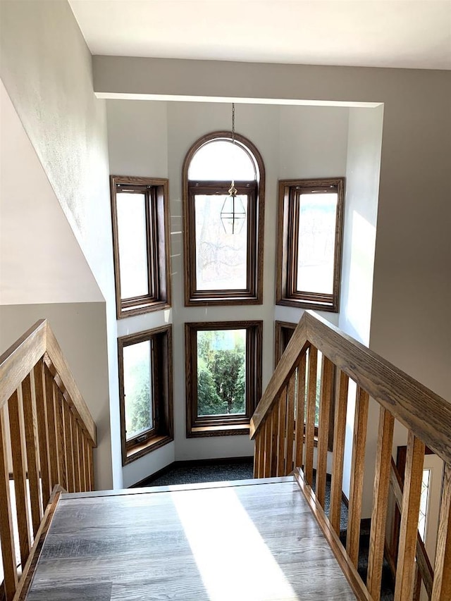 stairs featuring a towering ceiling