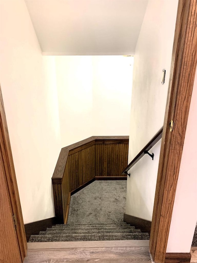 stairs with hardwood / wood-style floors