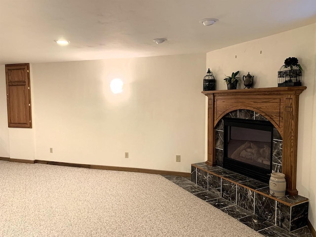living room with a tile fireplace