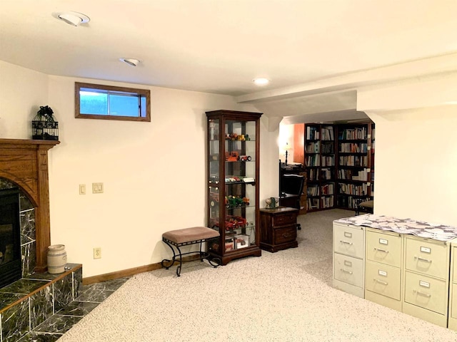 interior space with a tile fireplace