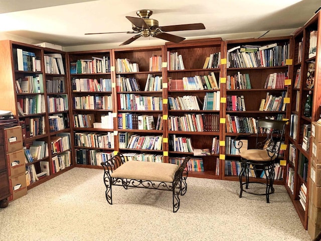 living area featuring ceiling fan
